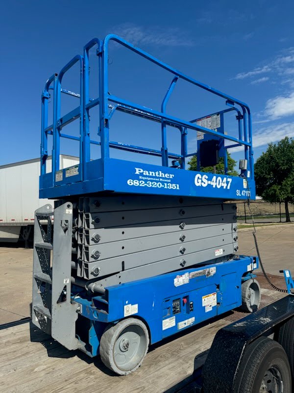 Genie scissor lift on trailer — Panther Equipment Rental