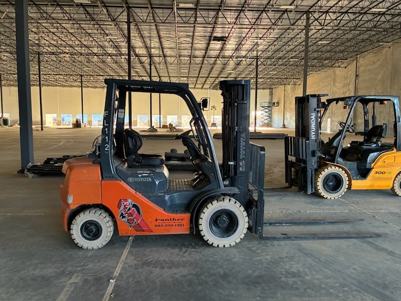 Hyundai and Toyota forklifts side by side — Panther Equipment Rental fleet