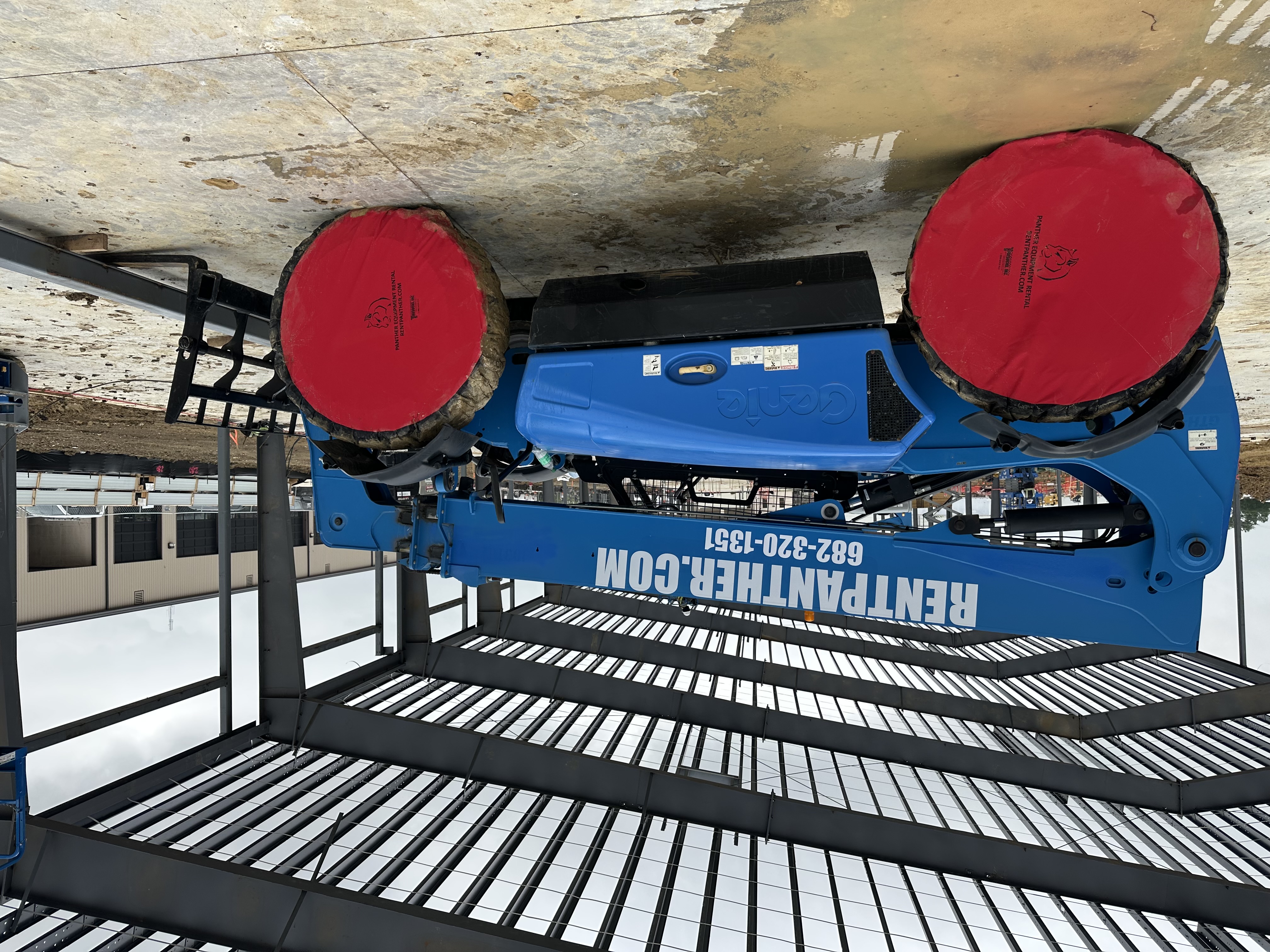 Genie GTH telehandler with Panther Equipment Rental branding on job site
